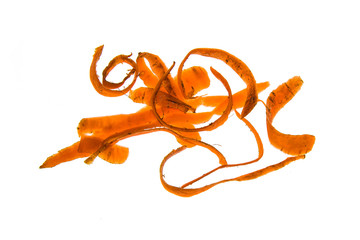 Peeling carrots on a white background