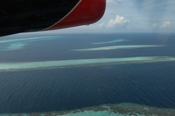 Naklejka na ściany i meble The beautiful atolls of the Maldives seen from a plane