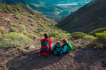 father with son and daughter travel in nature, family enjoy hiking