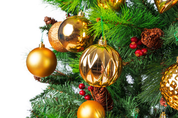 Spruce branches with golden baubles against white background