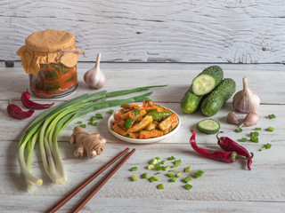 Traditional Korean cucumber kimchi snack on wooden table.