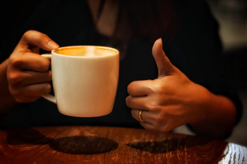 The taste of excellent coffee in a white glass.