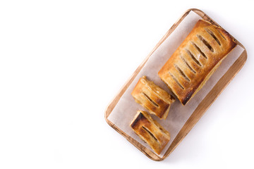 Traditional homemade apple strudel slice isolated on white background. Top view. Copy space