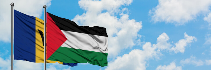 Barbados and Palestine flag waving in the wind against white cloudy blue sky together. Diplomacy concept, international relations.