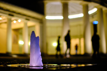 Illuminated water in front of  