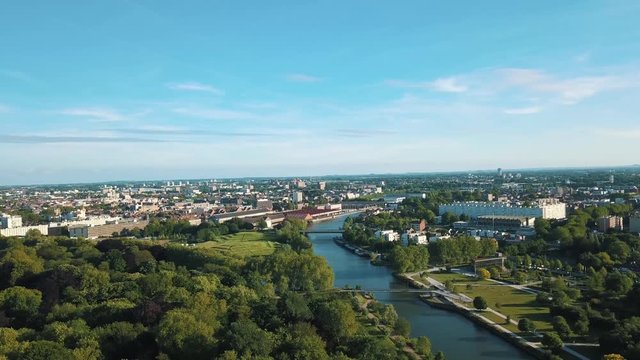 aerial view of the city of Lille, the de&ucirc;le canal and its green park, the citadel