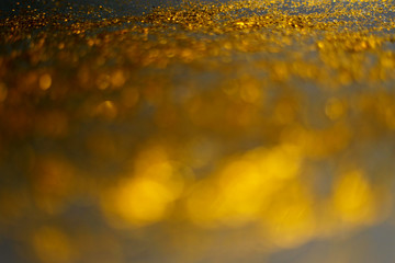 golden glitter sparkle isolated on black background