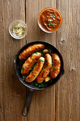 Fried sausages in frying pan