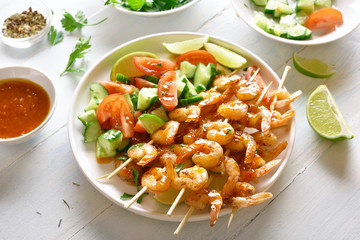 Prawns skewers with sauce