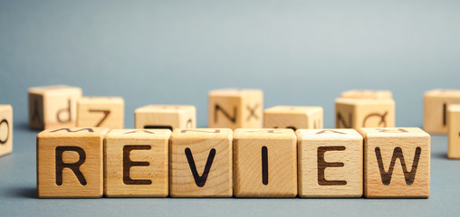 Wooden blocks with the word Review. Customer review concept. Reviewing, auditing, reviewer. Service rating. Feedback. - obrazy, fototapety, plakaty