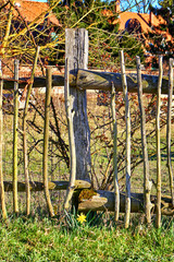 Old broken wooden picket fence.