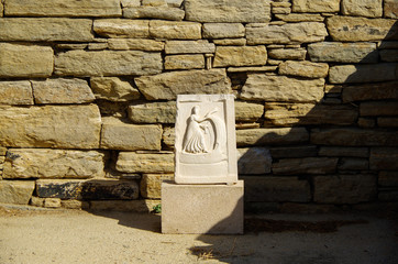 Ancient and historic temple ruins with columns and walls on archeologic site museum island Delos...