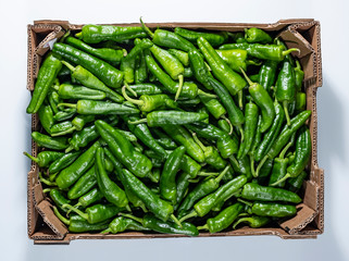 green chilipeppers in a box
