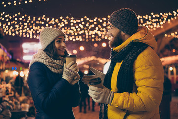 Photo of two people cute couple husband guy wife lady drink hot beverage x-mas eve spend time magic...