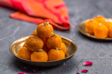 Motichoor Ladoo or Laddu - made from fine bundi, ball shaped sweets popular in indian subcontinent cooked with sugar, ghee or oil