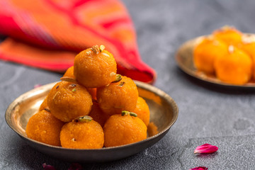 Motichoor Ladoo or Laddu - made from fine bundi, ball shaped sweets popular in indian subcontinent cooked with sugar, ghee or oil