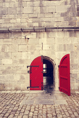 red entrance door to a fortress