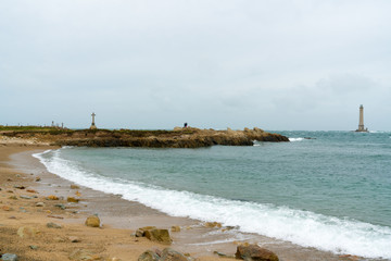 view of the Phare de Goury lighthouse on the north coast of Normandy in France