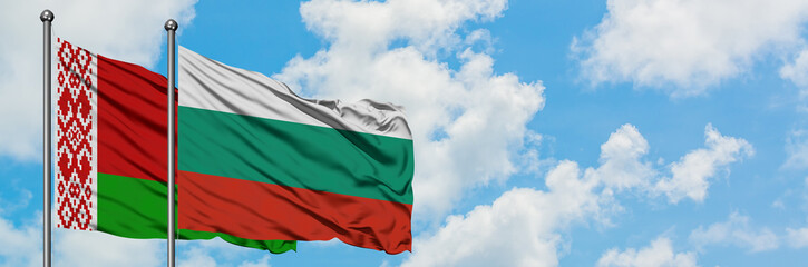 Belarus and Bulgaria flag waving in the wind against white cloudy blue sky together. Diplomacy concept, international relations.