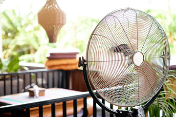 Fototapeta Electric fan cooling air during a hot day. obraz