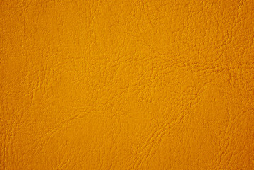 Elegant yellow orange leatherette background. Free space for text.