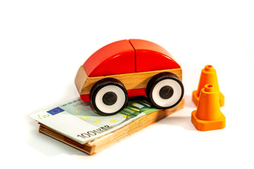 Red Car model with stack of a euro banknote, money