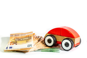 Red Car model with stack of a euro banknote, money
