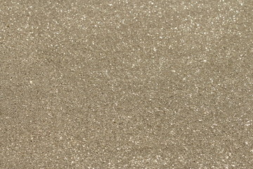Fototapeta premium Background of natural brillant golden sand with paettes