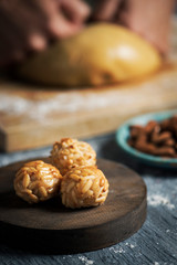 man preparing panellets, typical of Catalonia.