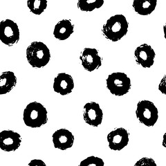 Thick hand drawn circles or rings. Seamless pattern in black and white. Perfect for wrapping paper, textile, fabric and backdrops. Vector polka dot pattern.