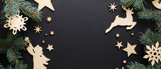 christmas wooden handmade decoration on black background