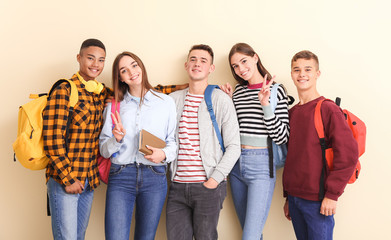 Portrait of teenagers on color background