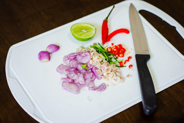 top view of  onions, chilies,lemon, To make tom yum on a wooden floor