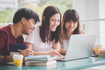 Learning and education concept, Asian student groups focus making reading information from laptop in the university preparing for test or final exam.