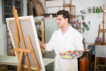 Artist painting on canvas