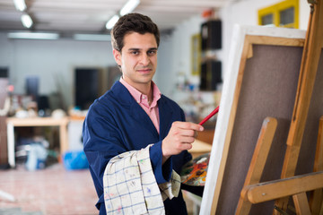 Male artist drawing in studio