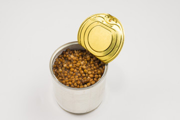 Canned food on white background. Lentils.