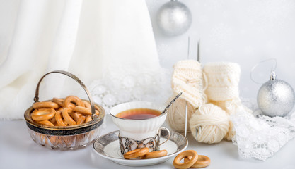 composition with decorations, tea and bread rings