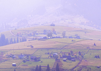 Carpatian village at mountains at the sunny day