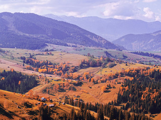 Carpatian village at mountains at the sunny day