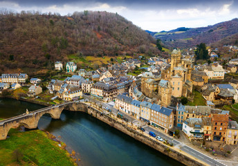 Aerial view of Estaing with castle and arched bridge