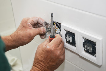 Electrican repair and installing socket, outlet plug