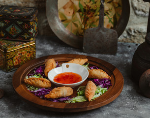 fried gurza served with sweet chili sauce, served with lettuce chops