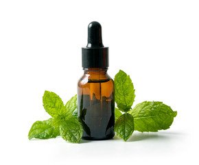 bottle with mint essential oil and green leaf isolated on white background