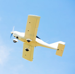 Image of sports plane flying rapidly  in the sky, outdoor