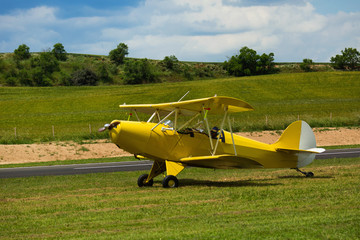 Fototapeta na wymiar Biplane parked on aerodrome