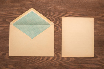 Envelope and paper on a wooden background 