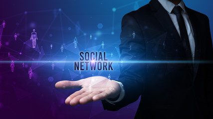Elegant hand holding SOCIAL NETWORK inscription, social networking concept