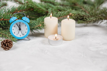 Christmas holiday background with vintage alarm-clock, Candy canes plastering background.