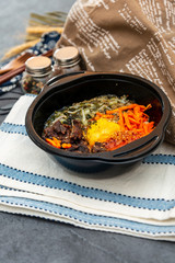 Bibimbap Rice, vegetables, minced marinated beef, spicy sauce and egg yolk